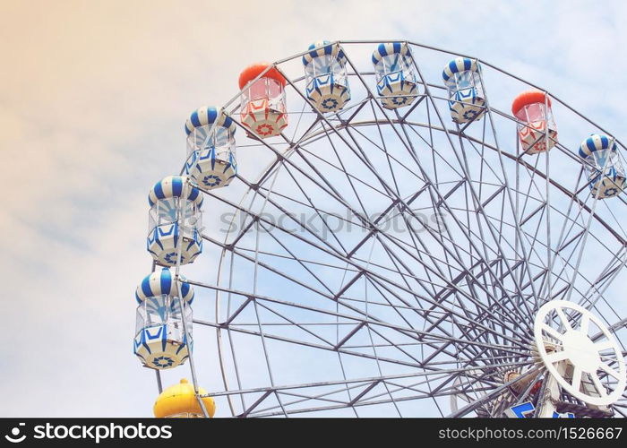 Ferris wheel on sky and cloud background