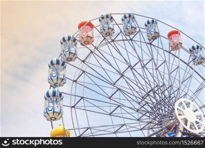 Ferris wheel on sky and cloud background