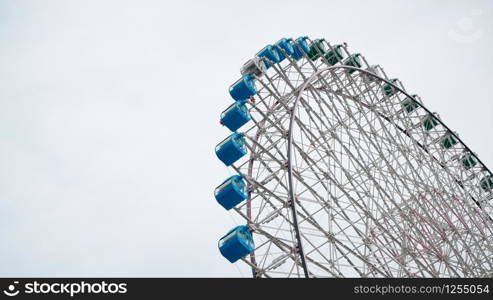 Ferris Wheel Over Blue Sky Background