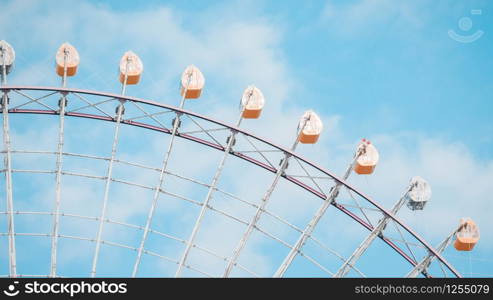 Ferris Wheel Over Blue Sky Background