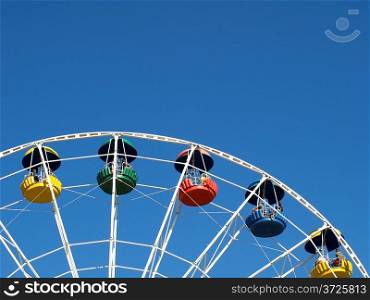 Ferris wheel with colorful cabins.