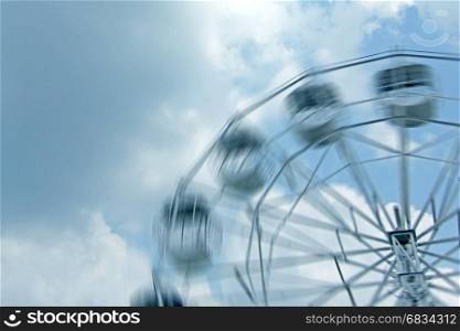ferris wheel with motion blurred with copy space
