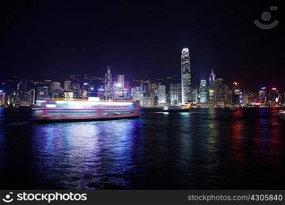 Ferry and harbor at night, Hong Kong, China