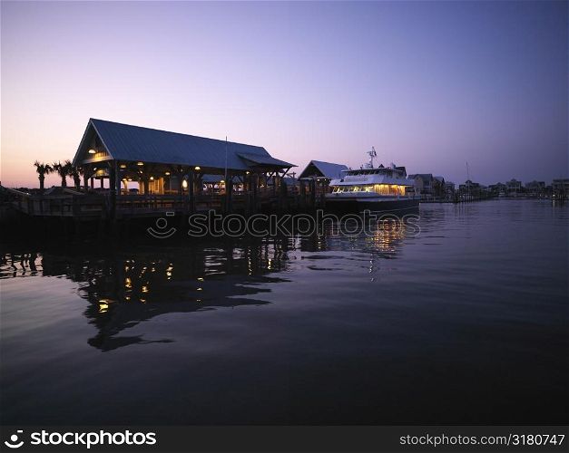 Ferry boat at dock at dusk at Bald Head Island, North Carolina.
