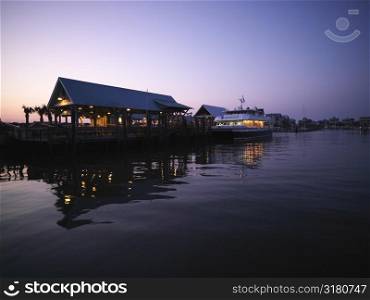 Ferry boat at dock at dusk at Bald Head Island, North Carolina.