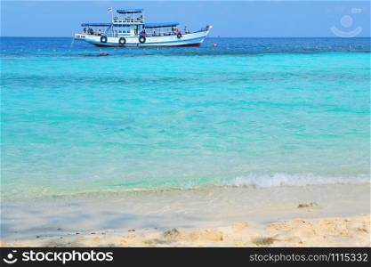 ferry boat on the sea thailand / seascape fishing boat ferry with tourist relax on bright day blue sky summer beach - travel vacation and holiday blue ocean