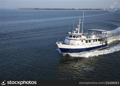 Ferry boat transporting passengers across Atlantic Ocean near Bald Head Island, North Carolina.