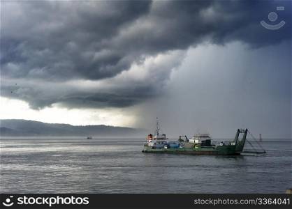Ferry from Java to Bali under the storm. Indonesia