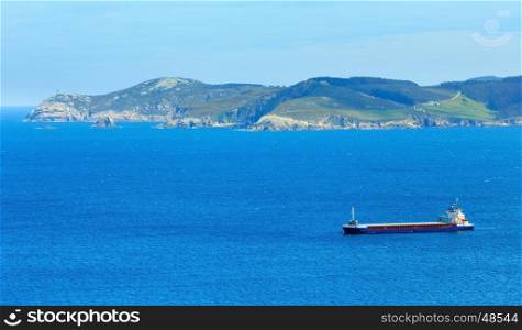 Ferryboat and Atlantic ocean summer coastline landscape (Galicia, Spain).