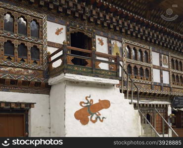 Fertility symbols on a row of houses in the town of Paro in the Kingdom of Bhutan.