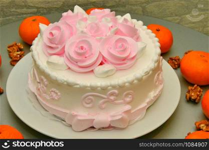 Festive cake with roses made of cream