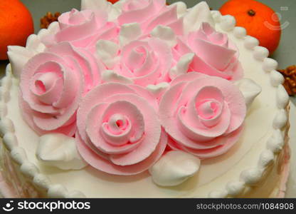 Festive cake with roses made of cream