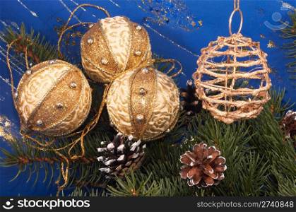 Festive Christmas composition with Christmas tree branch, pine-cones and holiday balls
