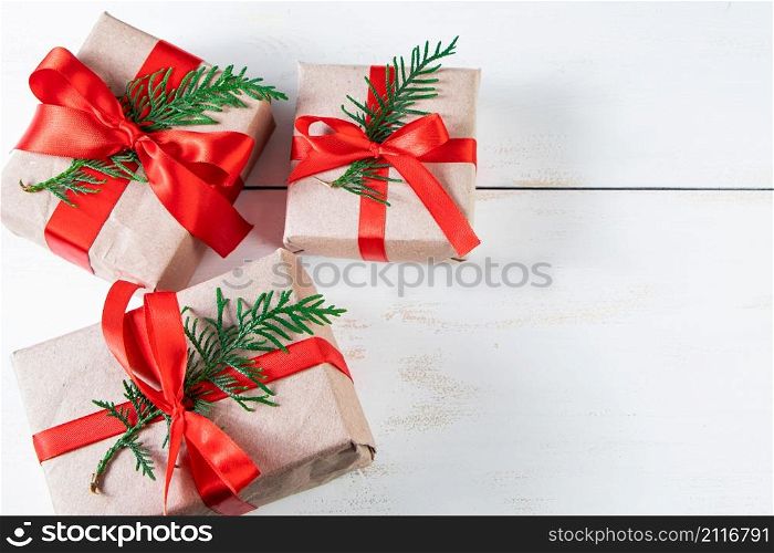 Festive composition. Gift boxes with red ribbon and Christmas balls on a white background.. Festive composition. Gift boxes with red ribbon and Christmas balls on white background.