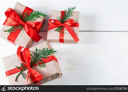 Festive composition. Gift boxes with red ribbon and Christmas balls on a white background.. Festive composition. Gift boxes with red ribbon and Christmas balls on white background.