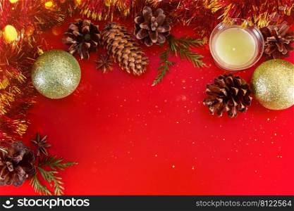 Festive composition of cones and Christmas balls on a red background for design and greeting cards. Place for text.. Festive composition of cones and Christmas balls on a red background for design and greeting cards.