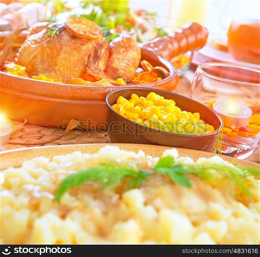 Festive dinner with baked chicken in centerpiece of table, celebration of Christmas holiday, different delicious dish in festive eve