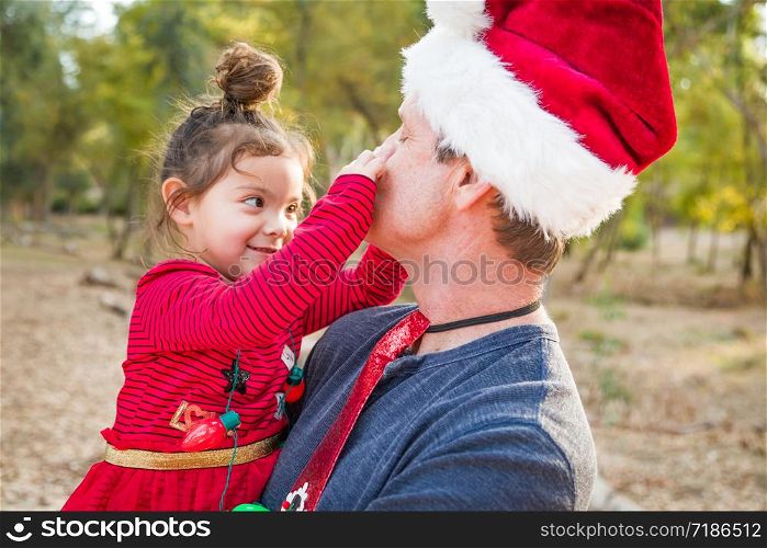 Festive Grandfather and Mixed Race Baby Girl Outdoors.