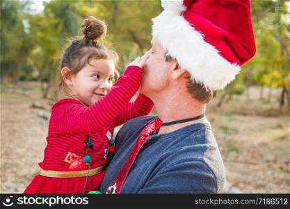 Festive Grandfather and Mixed Race Baby Girl Outdoors.