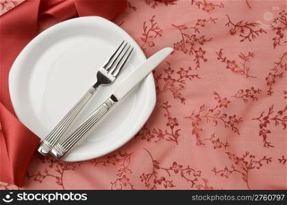 festive holiday place seting, plates, fork and knife, simple props
