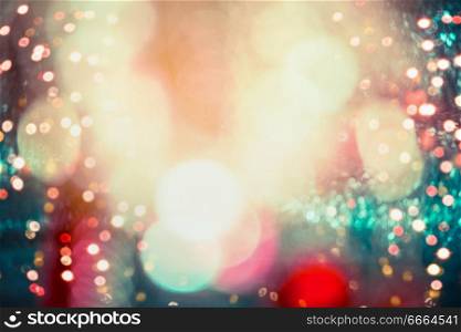 Festive holidays lighting bokeh on colorful event background, frame with copy space