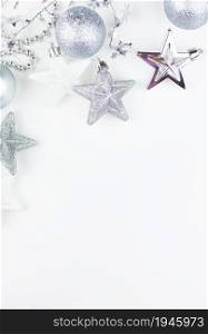 Festive mood, preparation for the holiday. New Year&rsquo;s festive decor in silvery colors - toys, star, round balls, place for an inscription. Festive mood, preparation for the holiday. New Year&rsquo;s festive decor in silvery colors - toys, star, round balls, place for an inscription.