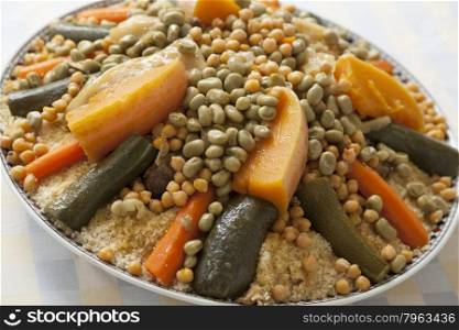 Festive Moroccan couscous with broad beans on a dish