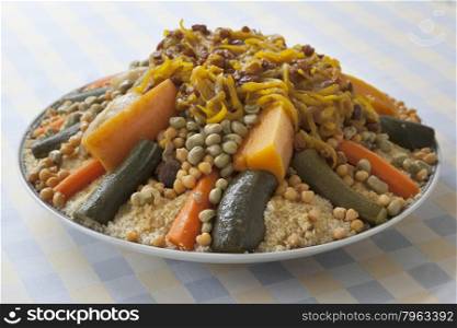 Festive Moroccan couscous with onions and raisins on a dish