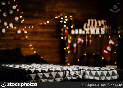 Festive New Year’s decor in the room. Sofa, fireplace, stars and lights. Happy New Year 2019 and Merry Christmas.