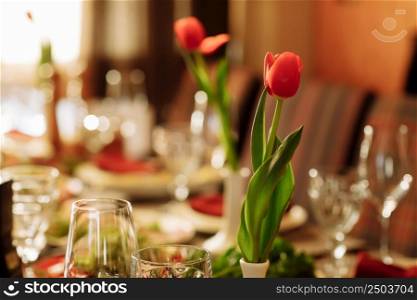 festive set table for the holiday with tulips flowers. High quality photo.. festive set table for the holiday with tulips flowers. High quality photo