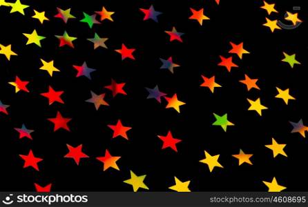 Festive starry background, many little colorful stars on black backdrop, beautiful Christmas decoration, festive wrapping paper