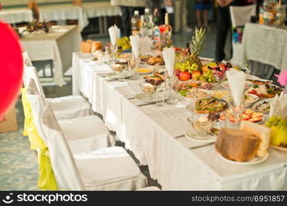 Festive table with appetizing snack.