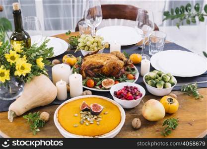 festive table with baked chicken vegetables