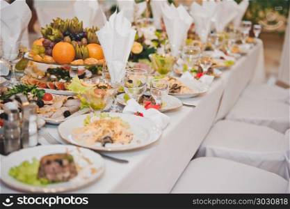 Festive table with food.. Table with dishes 2442.. Table with dishes 2442.