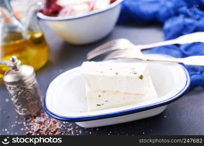 feta cheese in metal bowl on a table