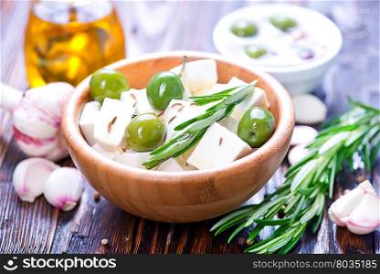 feta cheese with rosemary and green olives