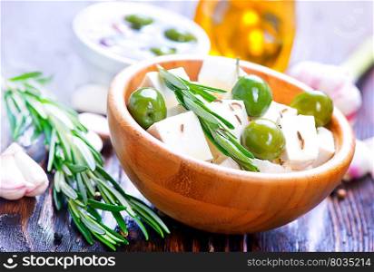 feta cheese with rosemary and green olives