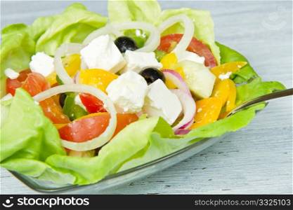 Feta salad with tomatoes, black olives and fresh vegetables
