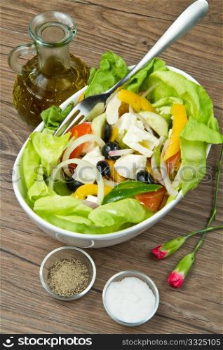 Feta salad with tomatoes, black olives and fresh vegetables