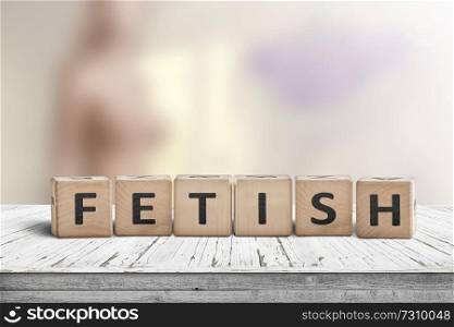 Fetish word on wooden cubes on a table with a blurry background