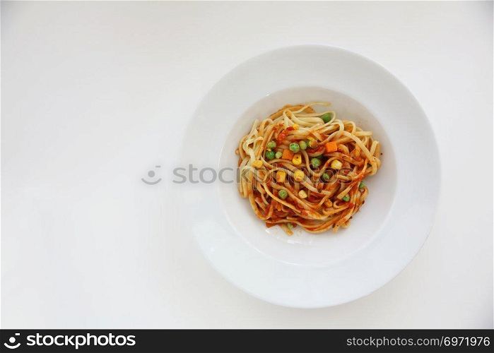 Fettuccine pasta in tomato sauce isolated in white background