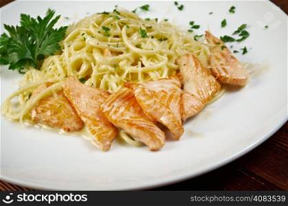 fettuccini pasta with salmon. close up