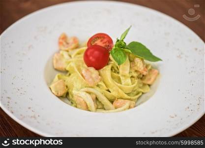 fettuccini with seafood . fettuccini with seafood and pesto sauce