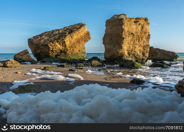 Few limestone stones on a Sunny autumn day on the seashore near the village of Fontanka, Odessa region, Ukraine. Several huge limestone stones by the sea