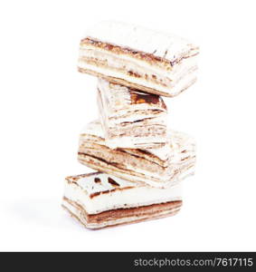 Few pieces of nougat stacked together on white