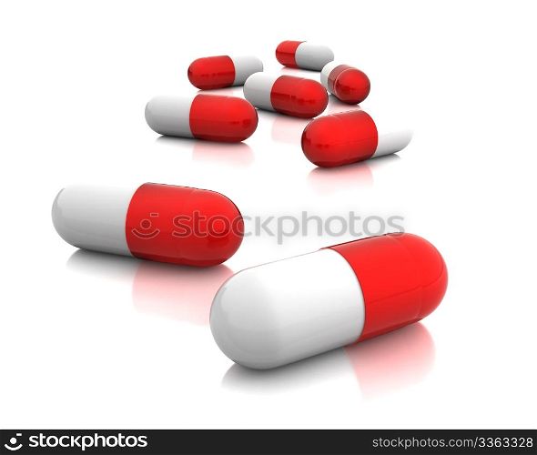 Few red pills isolated on white background