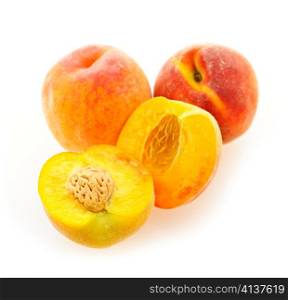 Few ripe peaches isolated on white background
