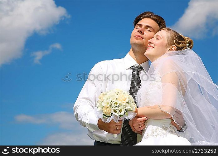 fiance and bride against the background of the sky