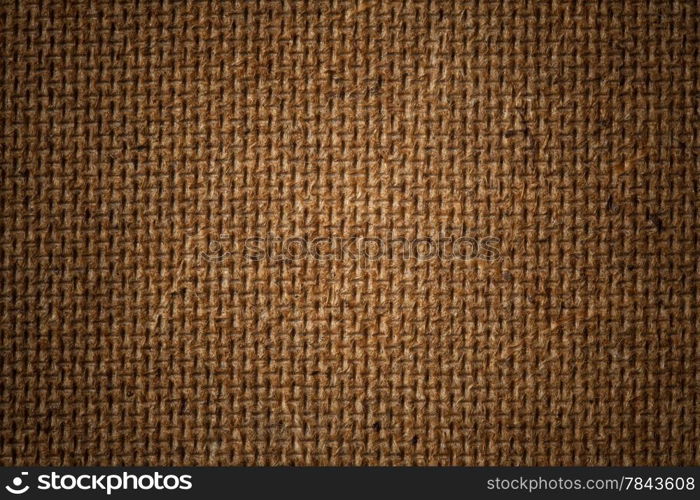 Fiberboard texture pattern, brown abstract background. Rough side of a piece of hardboard with vignette