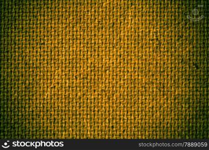 Fiberboard texture pattern, yellow abstract background. Rough side of a piece of hardboard with dark green vignette